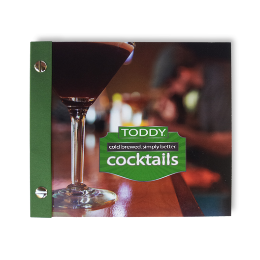 close up shot of Toddy merchandise cocktail recipe guide book