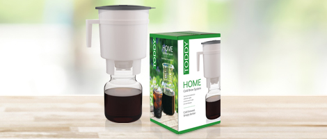 Toddy Home Cold Brew System item next to box on wood table