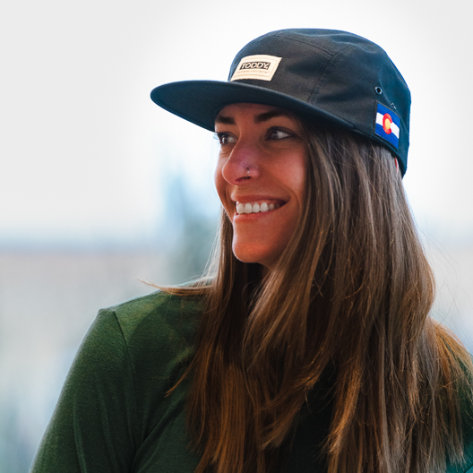 Woman wearing Toddy branded 5 panel hat