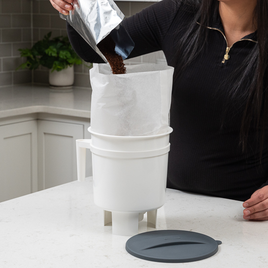 Pouring coffee into the Toddy cold brew system