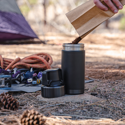 Adding coffee to the Go Brewer while camping
