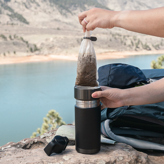 Draining a brew your own filter in a Gunmetal and Black Toddy Go Brewer while camping