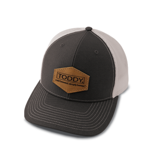 close up shot of Toddy merchandise trucker hat with the polygon style patch
