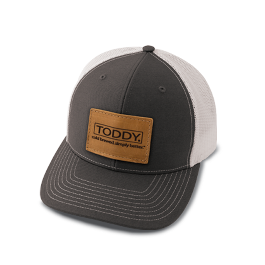 close up shot of Toddy merchandise trucker hat with the rectangle style patch