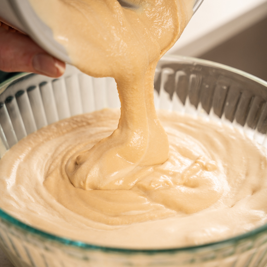 Adding ice cream mixture to airtight container