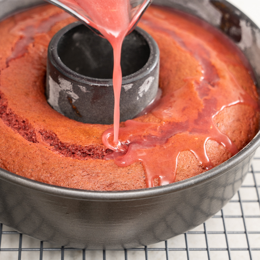 Adding glaze to the coffee cake