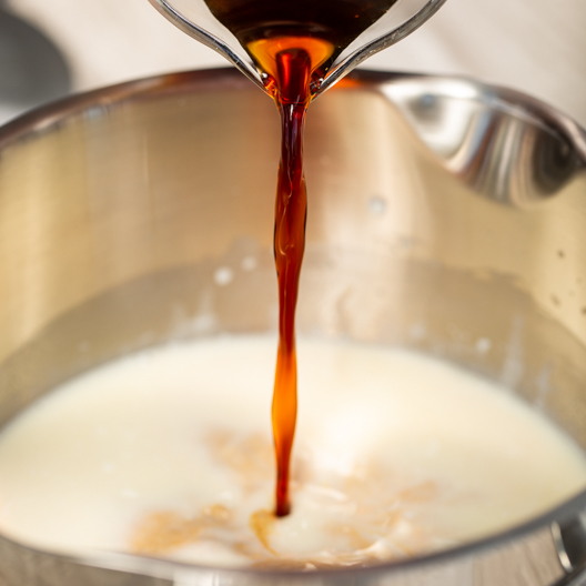 adding coffee concentrate to milk mixture