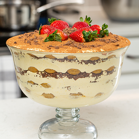 Toddy Tiramisu topped with strawberries in a large serving dish