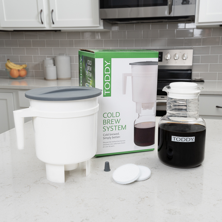 Toddy Cold Brew System Package, Brewer, Carafe with Coffee, 2 Felt Filters, and Stopper